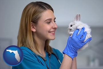 young female vet caring for a bunny - with Florida icon