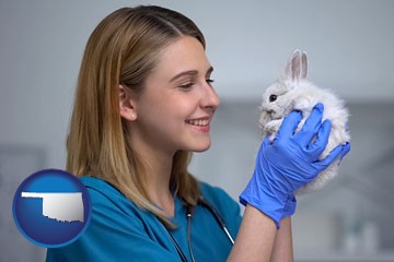 young female vet caring for a bunny - with Oklahoma icon
