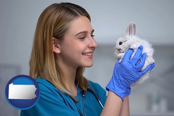 young female vet caring for a bunny - with Pennsylvania icon