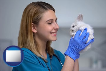 young female vet caring for a bunny - with Wyoming icon