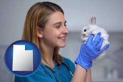 young female vet caring for a bunny - with UT icon